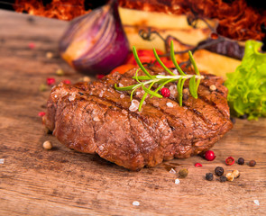 Grilled steak on wood
