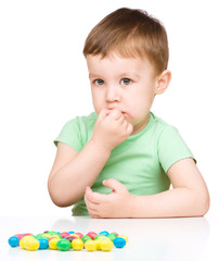 Portrait of a boy with candies