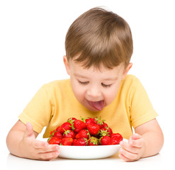 Little boy with strawberries