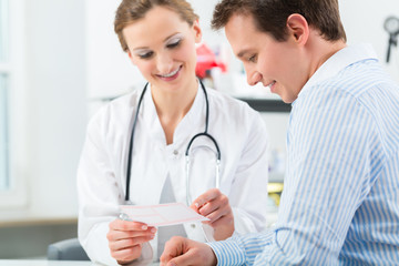 Doctor with patient in clinic consulting