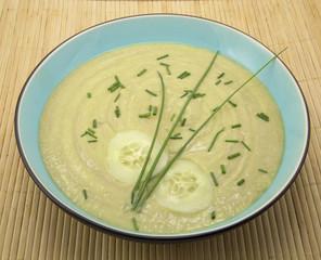 Cucumber and avocado soup on bamboo placemat