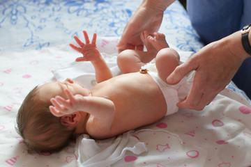 Newborn (8 days old) baby examined by a pediatrician