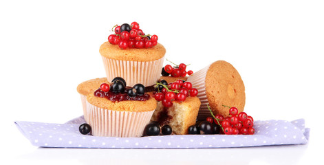 Tasty muffins with berries isolated on white