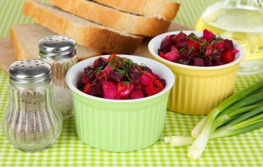 Beet salad in bowls on table close-up
