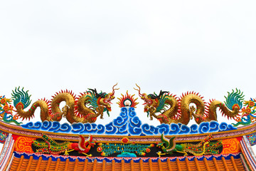 Double gragon statue on chinese temple roof