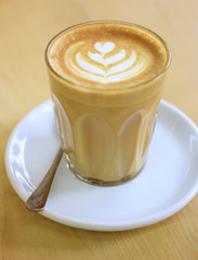 Cup of art latte or cappuccino coffee