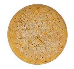 Farmhouse whole round goats cheese overhead view, isolated over