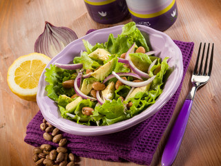 salad with avocado lettuce beans and onions
