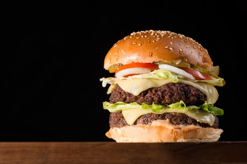 big burger isolated on black