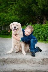 Little boy with a golden retriever