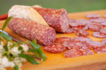 chopping board of salami of sliced