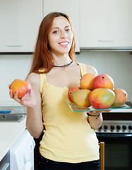 long-haired woman with mango