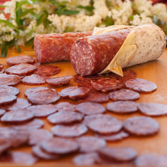 chopping board of salami of sliced