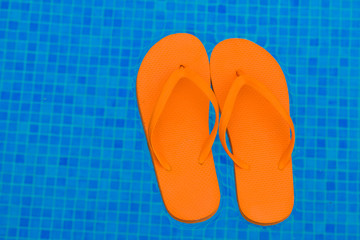 flip flops in pool water