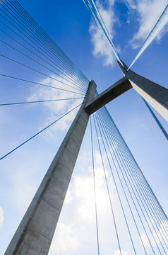 The top of the cable-stayed bridge in the cloud blue sky