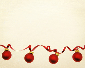 Gold glitter paper with red baubles Copy space for text