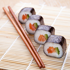 Delicious fresh sushi rolls on the mat