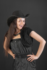 cheerful girl in a black hat
