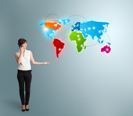 young woman making phone call with colorful world map