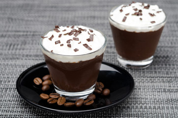 chocolate-coffee mousse with whipped cream in portions