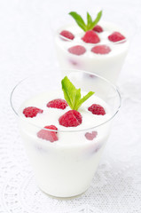 panna cotta with fresh raspberries, vertical