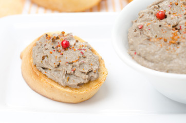 toast with liver pate with pink pepper