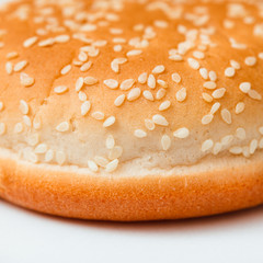 Close-up of burger bun with sesame seeds
