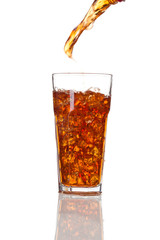 Cola pouring in a glass, isolated on white background