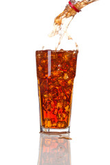 Cola pouring in a glass, isolated on white background