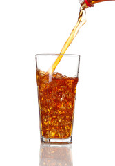 Cola pouring in a glass, isolated on white background