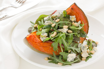 Pumpkin salad with arugula and cheese.