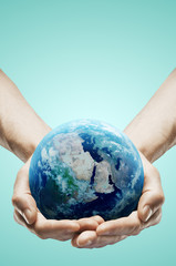 hands holding earth