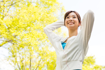 young asian woman relaxing in the park