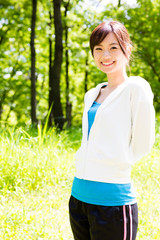 young asian woman relaxing in the park