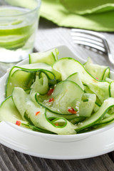 Salad of cucumber, sesame seeds and pepper.