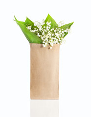 lily of the valley in a paper bag