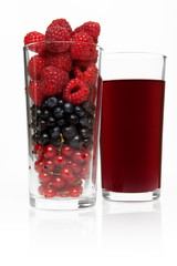 glass with berries and juice