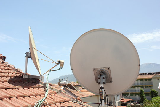 Satallite dish's on top of roofing