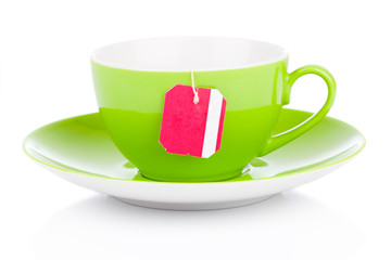green tea cup with tea bag. Isolated on white background