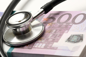 Stethoscope and euro banknotes cash closeup