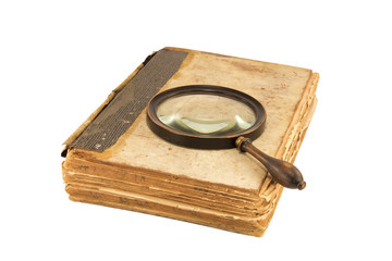 Old book and magnifying glass