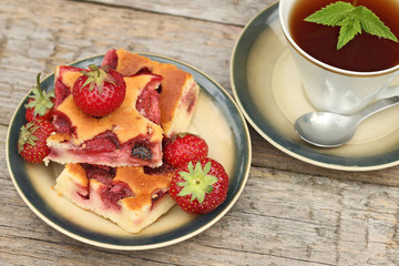 Fresh baked Strawberry Cake on wooden background