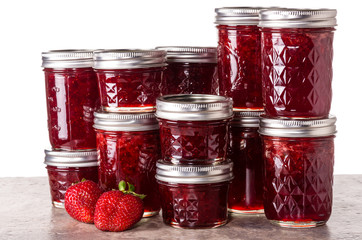 Fresh strawberries preserved in jars