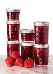Fresh strawberries preserved in jars