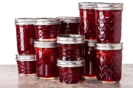 Fresh strawberries preserved in jars