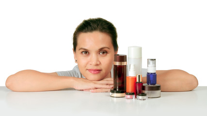 Isolated middle age asian woman with cosmetic cream