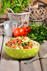 Bowl of vegetable salad on wooden table