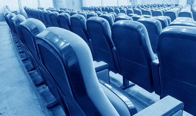 Empty hall for presentation with red armchairs