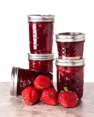 Fresh strawberries preserved in jars