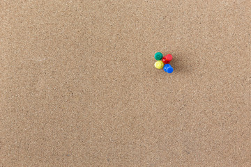 Colourful Pushpin On Cork Board